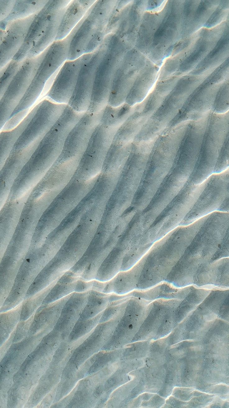 Rippling shallow coastal water with soft light